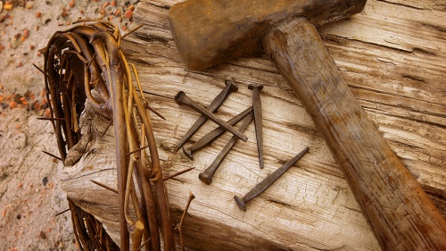 Crown of thorns, old nails and old hammer.