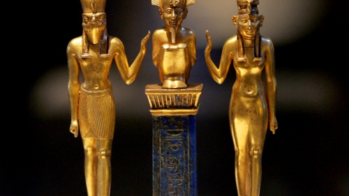Gold figurines of Egyptian gods Osiris, Horus and Isis